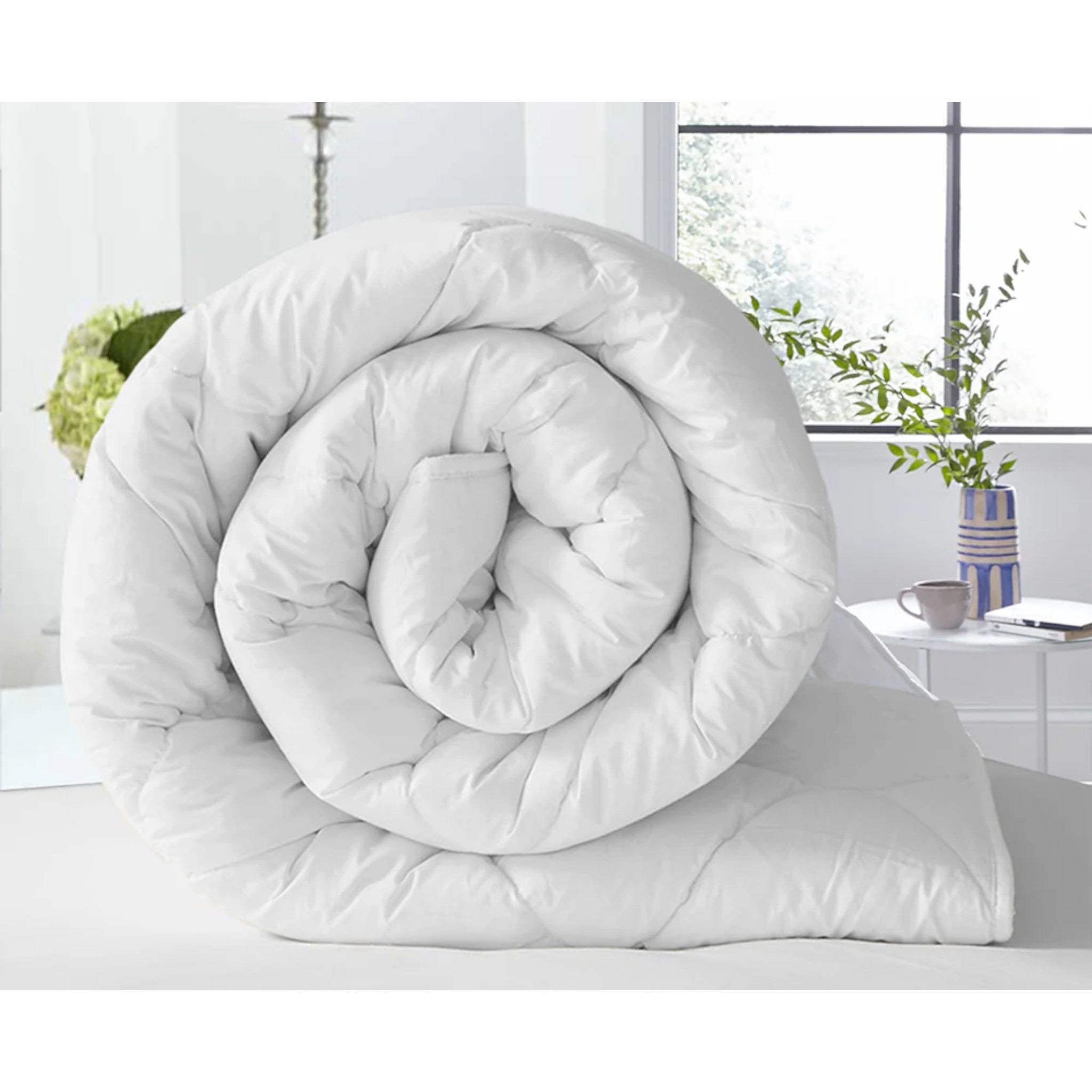Soft and lightweight white duvet, perfect for all-season comfort. hypoallergenic, breathable duvet adds luxury and warmth to any bedroom. Single, Double King.